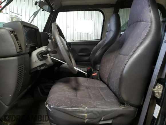 2002 Jeep Wrangler Sport with VIN 1J4FA49S62P713475, listed as a Copart auction lot 59299965 with 114,654 mi miles and Non repairable. Bid and sale history available at DreamBid. Image 7.