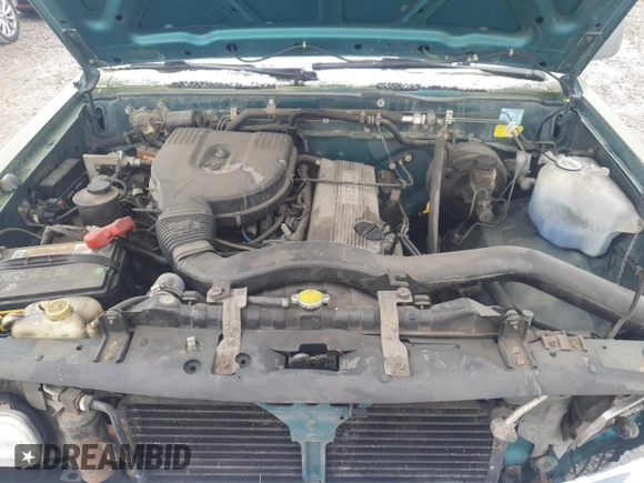 1996 Nissan Frontier XE with VIN 1N6SD16SXTC322219, listed as a Copart auction lot 49043685 with 102,964 mi miles and Salvage title. Bid and sale history available at DreamBid. Image 12.