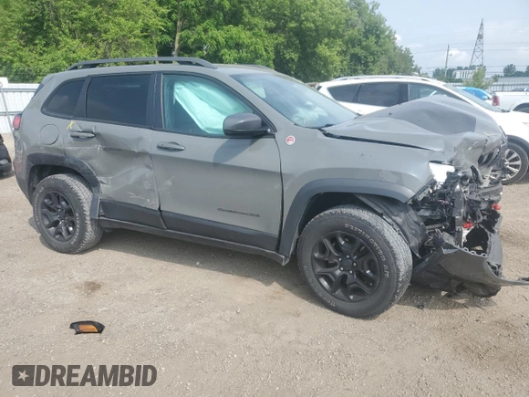2019 Jeep Cherokee Trailhawk with VIN 1C4PJMBX6KD425554, listed as a Copart auction lot 61097135 with 97,452 mi miles and Salvage title. Bid and sale history available at DreamBid. Image 4.