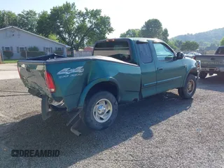 1999 Ford F-150 with VIN 1FTRX18W4XNA50527, listed as a IAAI auction lot 42563746 with 213,959 mi miles and . Bid and sale history available at DreamBid. Image 4.