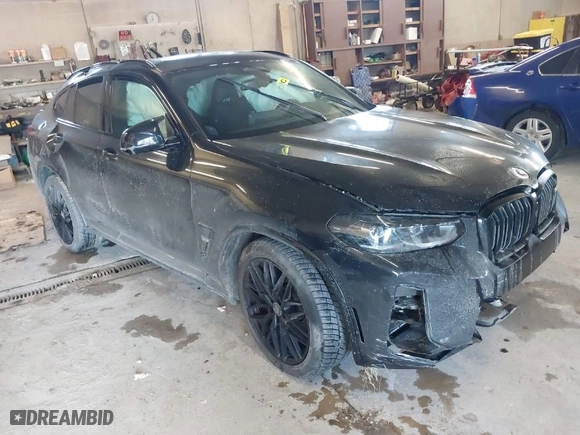 2023 BMW X4 M with VIN 5YM23EC05P9R57259, listed as a IAAI auction lot 41003784 with 33,928 mi miles. Bid and sale history available at carsss.com. Image 1.