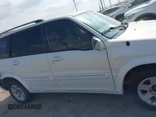 2003 Suzuki XL7 Touring z VIN JS3TY92V534106381, wystawiony jako IAAI lot #42063755 z przebiegiem 190 917 mil mil oraz . Historia ofert i sprzedaży dostępna na DreamBid. Obrazek 13.