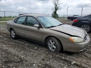 2003 Ford Taurus SES Standard z VIN 1FAFP55U33A123732, wystawiony jako Copart lot #58837395 z przebiegiem 169 159 mil mil oraz Szkoda całkowita • Salvage title. Historia ofert i sprzedaży dostępna na DreamBid. Obrazek 4.