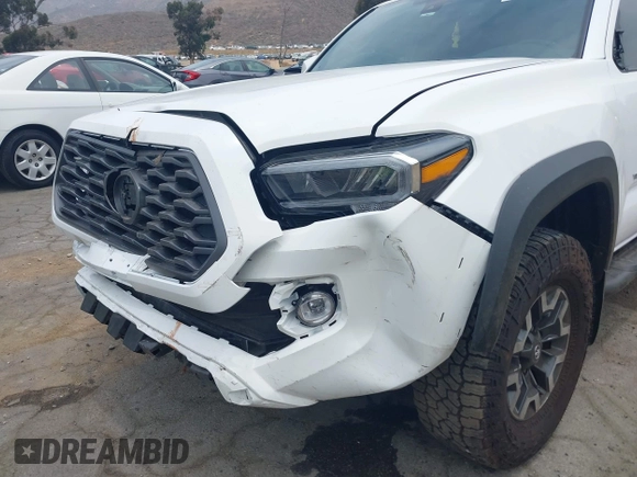 2023 Toyota Tacoma SR with VIN 3TMCZ5AN1PM556299, listed as a IAAI auction lot 42344160 with 42,338 mi miles and . Bid and sale history available at DreamBid. Image 6.