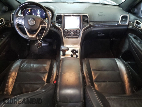 2015 Jeep Grand Cherokee Overland with VIN 1C4RJFCG8FC653117, listed as a Copart auction lot 49254595 with 142,359 mi miles and Clean Title. Bid and sale history available at carsss.com. Image 8.