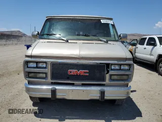 1994 GMC Vandura z VIN 1GDEG25K4RF512695, wystawiony jako Copart lot #63562414 z przebiegiem 171 855 mil mil oraz Szkody całkowita. Historia ofert i sprzedaży dostępna na DreamBid. Obrazek 5.