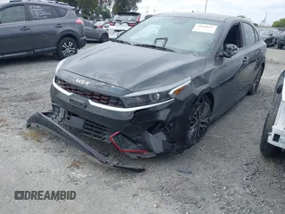 2023 Kia Forte GT-Line z VIN 3KPF54AD8PE539617, wystawiony jako IAAI lot #41890617 z przebiegiem 26 855 mil mil oraz . Historia ofert i sprzedaży dostępna na DreamBid. Obrazek 2.