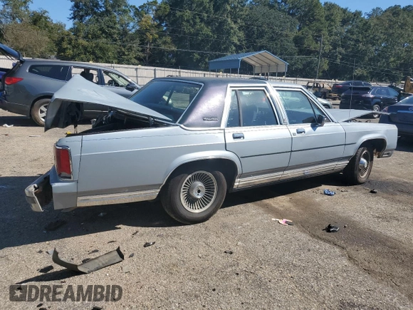 1989 Ford Crown Victoria z VIN 2FABP74F2KX141884, wystawiony jako Copart lot #74934494 z przebiegiem 84 761 mil mil oraz Szkoda całkowita • Salvage title. Historia ofert i sprzedaży dostępna na DreamBid. Obrazek 3.