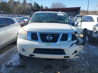 2015 Nissan Armada Platinum z VIN 5N1BA0NF7FN611136, wystawiony jako IAAI lot #41375085 z przebiegiem 130 819 mil mil oraz . Historia ofert i sprzedaży dostępna na DreamBid. Obrazek 12.