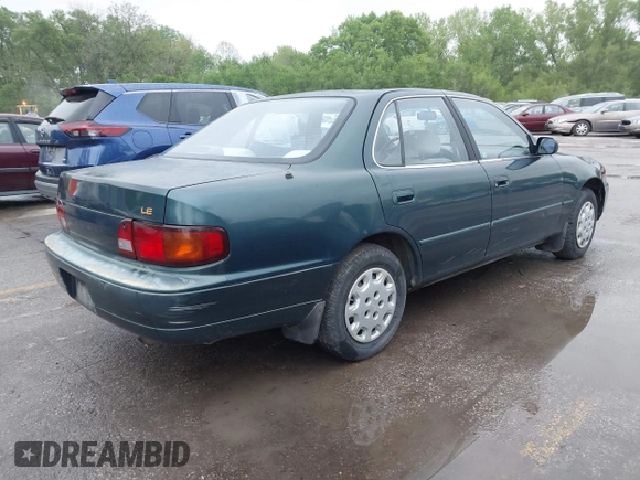 1996 Toyota Camry DX with VIN JT2BG12K5T0346311, listed as a IAAI auction lot 42130482 with 214,872 mi miles. Bid and sale history available at carsss.com. Image 4.