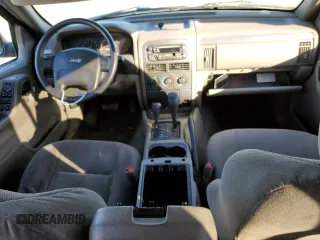 2001 Jeep Grand Cherokee Laredo z VIN 1J4GW48S91C578800, wystawiony jako Copart lot #87934695 z przebiegiem 250 784 mil mil oraz Szkoda całkowita • Salvage title. Historia ofert i sprzedaży dostępna na DreamBid. Obrazek 8.