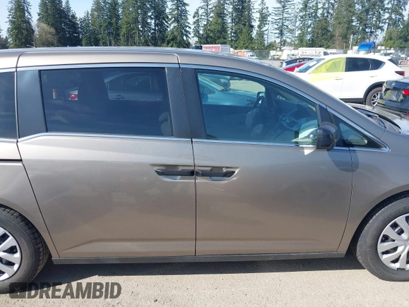 2013 Honda Odyssey LX z VIN 5FNRL5H29DB055166, wystawiony jako IAAI lot #41965037 z przebiegiem 122 470 mil mil oraz . Historia ofert i sprzedaży dostępna na DreamBid. Obrazek 13.