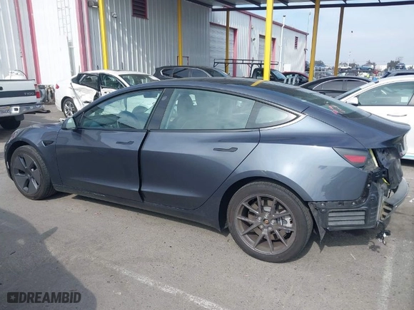2023 Tesla Model 3 with VIN 5YJ3E1EA0PF577869, listed as a IAAI auction lot 41468956 with 38,760 mi miles. Bid and sale history available at carsss.com. Image 14.