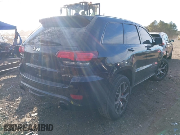 2017 Jeep Grand Cherokee SRT with VIN 1C4RJFDJ3HC694736, listed as a IAAI auction lot 41292771 with 79,966 mi miles. Bid and sale history available at carsss.com. Image 4.