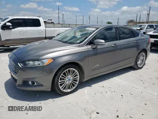 2013 Ford Fusion SE Hybrid z VIN 3FA6P0LU8DR261232, wystawiony jako Copart lot #60674105 z przebiegiem 132 901 mil mil oraz Czysty tytuł • Clean title. Historia ofert i sprzedaży dostępna na DreamBid. Obrazek 1.