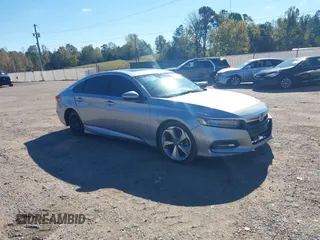 2018 Honda Accord Touring with VIN 1HGCV1F9XJA006377, listed as a IAAI auction lot 40860149 with 209,217 mi miles and . Bid and sale history available at DreamBid. Image 1.
