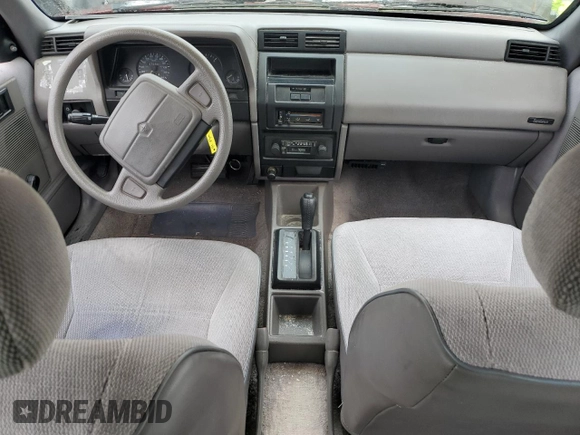 1992 Plymouth Sundance z VIN 1P3XP28D4NN165248, wystawiony jako Copart lot #44205855 z przebiegiem 70 897 mil mil oraz Czysty tytuł • Clean title. Historia ofert i sprzedaży dostępna na DreamBid. Obrazek 9.