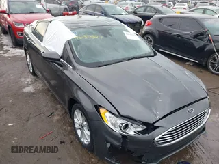 2020 Ford Fusion SE z VIN 3FA6P0LU6LR185721, wystawiony jako IAAI lot #41639827 z przebiegiem 63 857 mil mil oraz . Historia ofert i sprzedaży dostępna na DreamBid. Obrazek 6.