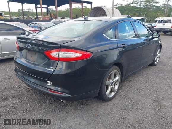 2013 Ford Fusion SE Hybrid z VIN 3FA6P0LUXDR181849, wystawiony jako IAAI lot #41949276 z przebiegiem 112 688 mil mil oraz . Historia ofert i sprzedaży dostępna na DreamBid. Obrazek 4.