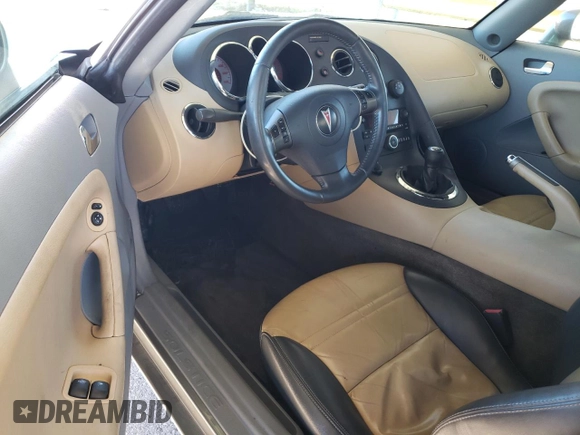 2006 Pontiac Solstice z VIN 1G2MB33BX6Y109591, wystawiony jako Copart lot #80684234 z przebiegiem 90 032 mil mil oraz Czysty tytuł • Clean title. Historia ofert i sprzedaży dostępna na DreamBid. Obrazek 8.
