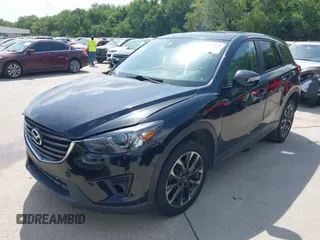 2016 Mazda CX-5 Grand Touring z VIN JM3KE2DY2G0765444, wystawiony jako IAAI lot #42527577 z przebiegiem 162 871 mil mil oraz . Historia ofert i sprzedaży dostępna na DreamBid. Obrazek 17.