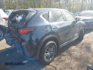 2019 Mazda CX-5 Touring with VIN JM3KFBCM6K0513037, listed as a IAAI auction lot 42121789 with 59,455 mi miles and . Bid and sale history available at DreamBid. Image 4.