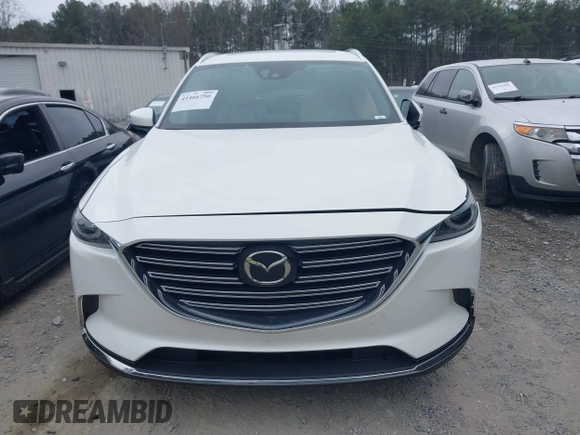 2016 Mazda CX-9 Grand Touring with VIN JM3TCADY0G0113779, listed as a IAAI auction lot 41466750 with 58,035 mi miles and . Bid and sale history available at DreamBid. Image 12.