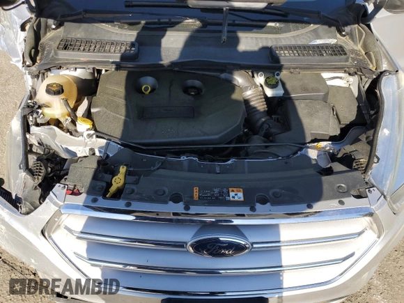 2018 Ford Escape SE z VIN 1FMCU9G96JUB49271, wystawiony jako Copart lot #50553205 z przebiegiem 91 123 mil mil oraz Szkoda całkowita • Salvage title. Historia ofert i sprzedaży dostępna na DreamBid. Obrazek 12.