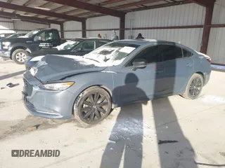 2021 Mazda 6 Carbon Edition with VIN JM1GL1WY6M1616617, listed as a IAAI auction lot 41365615 with 60,747 mi miles and . Bid and sale history available at DreamBid. Image 2.
