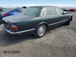 1999 Jaguar XJ with VIN SAJKX6047XC861227, listed as a Copart auction lot 75007414 with Not provided miles and Salvage title. Bid and sale history available at DreamBid. Image 3.