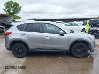 2014 Mazda CX-5 Touring z VIN JM3KE2CY8E0369145, wystawiony jako IAAI lot #42462985 z przebiegiem 155 480 mil mil oraz . Historia ofert i sprzedaży dostępna na DreamBid. Obrazek 13.