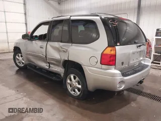 2004 GMC Envoy SLE with VIN 1GKDT13S042243883, listed as a IAAI auction lot 41795335 with 162,873 mi miles. Bid and sale history available at carsss.com. Image 3.