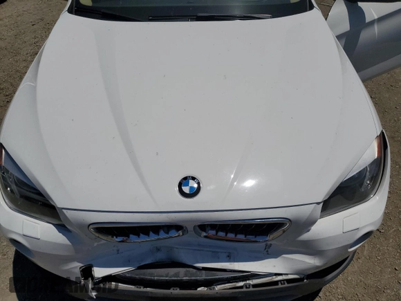 2014 BMW X1 sDrive28i z VIN WBAVM1C51EVW51832, wystawiony jako Copart lot #60153925 z przebiegiem 101 781 mil mil oraz Szkoda całkowita • Salvage title. Historia ofert i sprzedaży dostępna na DreamBid. Obrazek 11.