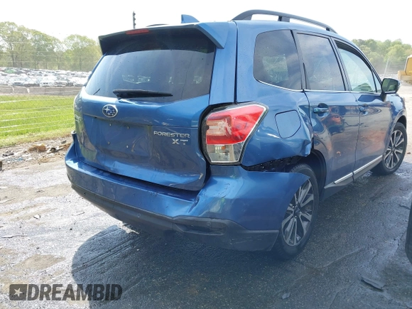 2017 Subaru Forester Touring with VIN JF2SJGWC5HH567870, listed as a IAAI auction lot 42007542 with 76,560 mi miles. Bid and sale history available at carsss.com. Image 4.