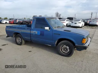 1982 Datsun 720 z VIN JN6SD01SXCW102918, wystawiony jako Copart lot #51125715 z przebiegiem 226 428 mil mil oraz Tytuł czysty. Historia ofert i sprzedaży dostępna na DreamBid. Obrazek 4.