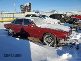 1999 Jaguar XJ with VIN SAJPD1841XC869913, listed as a Copart auction lot 41449445 with Not provided miles and Salvage title. Bid and sale history available at DreamBid. Image 4.