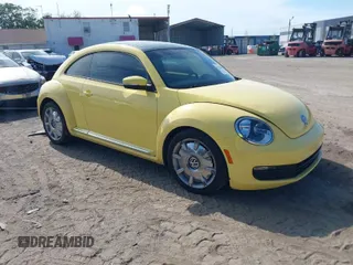 2012 Volkswagen Beetle 2.5L with VIN 3VWJX7AT9CM651806, listed as a IAAI auction lot 41912080 with 143,195 mi miles. Bid and sale history available at carsss.com. Image 1.