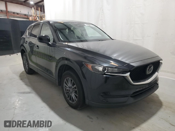 2021 Mazda CX-5 Touring with VIN JM3KFBCM5M0343577, listed as a Copart auction lot 52411005 with 70,372 mi miles and Clean Title. Bid and sale history available at carsss.com. Image 4.