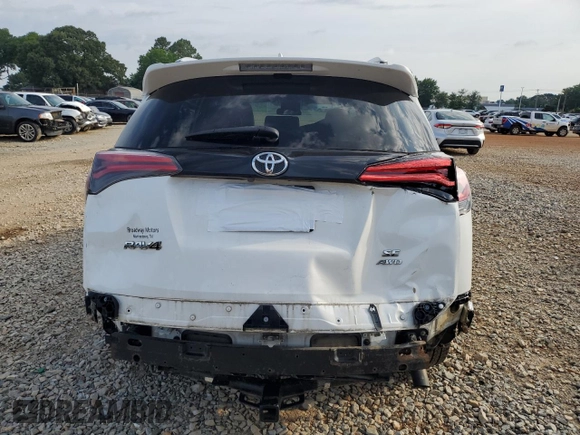 2016 Toyota RAV4 SE with VIN JTMJFREV5GD184074, listed as a Copart auction lot 60116955 with 182,240 mi miles and Salvage title. Bid and sale history available at DreamBid. Image 6.