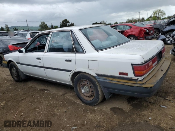 1991 Toyota Camry z VIN 4T1SV24E5MU355011, wystawiony jako Copart lot #51021185 z przebiegiem 135 881 mil mil oraz Czysty tytuł • Clean title. Historia ofert i sprzedaży dostępna na DreamBid. Obrazek 2.