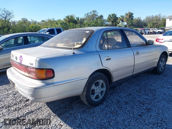 1994 Toyota Camry LE with VIN 4T1SK12E9RU351895, listed as a IAAI auction lot 41239573 with 184,866 mi miles. Bid and sale history available at carsss.com. Image 4.