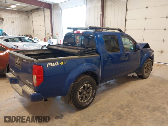 2015 Nissan Frontier SV with VIN 1N6AD0EV4FN709892, listed as a IAAI auction lot 42473594 with 153,103 mi miles and . Bid and sale history available at DreamBid. Image 4.