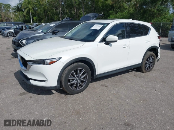2018 Mazda CX-5 Grand Touring with VIN JM3KFBDM6J0451605, listed as a IAAI auction lot 42099182 with 81,703 mi miles and . Bid and sale history available at DreamBid. Image 2.