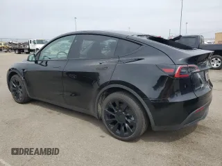 2023 Tesla Model Y Long Range z VIN 7SAYGDEE0PF869710, wystawiony jako Copart lot #52885365 z przebiegiem 13 919 mil mil oraz Szkoda całkowita • Salvage title. Historia ofert i sprzedaży dostępna na DreamBid. Obrazek 2.