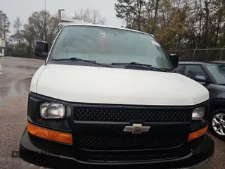 2014 Chevrolet Express Cargo Van with VIN 1GCWGFCA8E1121017, listed as a IAAI auction lot 41944246 with 216,471 mi miles. Bid and sale history available at carsss.com. Image 1.