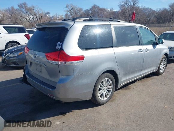 2011 Toyota Sienna XLE AAS with VIN 5TDYK3DC4BS014986, listed as a IAAI auction lot 41763681 with 169,619 mi miles. Bid and sale history available at carsss.com. Image 4.