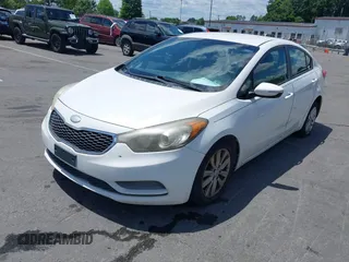 2014 Kia Forte LX with VIN KNAFX4A61E5055158, listed as a IAAI auction lot 42212501 with 224,830 mi miles and . Bid and sale history available at carsss.com. Image 2.