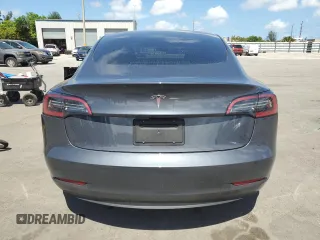 2023 Tesla Model 3 with VIN 5YJ3E1EA8PF704349, listed as a Copart auction lot 60220665 with 18,873 mi miles and Non repairable. Bid and sale history available at DreamBid. Image 6.