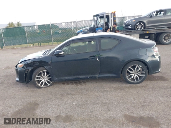2015 Scion tC with VIN JTKJF5C7XFJ001662, listed as a IAAI auction lot 41843123 with 128,851 mi miles. Bid and sale history available at carsss.com. Image 14.