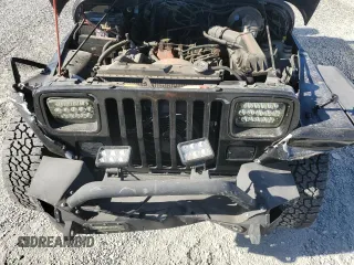 1995 Jeep Wrangler S with VIN 1J4FY19P7SP209782, listed as a Copart auction lot 84476294 with 157,029 mi miles and Salvage Title. Bid and sale history available at carsss.com. Image 11.